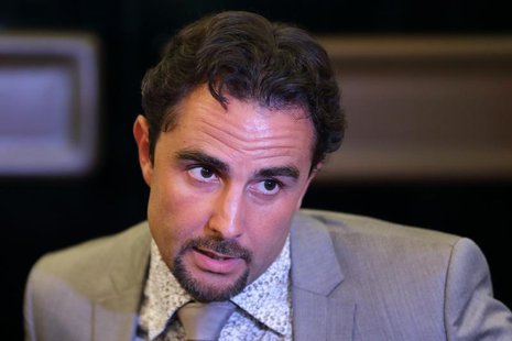 Herve Falciani, an ex-HSBC employee wanted in Switzerland on charges of stealing data on bank accounts, speaks to the media after a French p Herve Falciani, an ex-HSBC employee wanted in Switzerland on charges of stealing data on bank accounts, speaks to the media after a French p