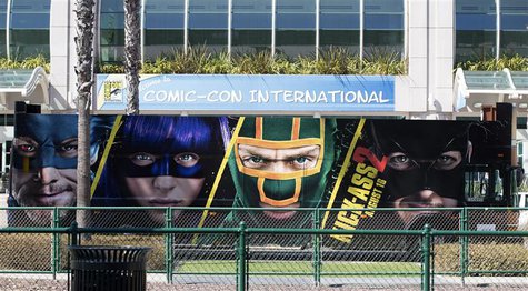 A bus with an advertisement for the movie "Kick-Ass 2" drives past the San Diego Convention Center a day before the start of the 2013 Comic- A bus with an advertisement for the movie "Kick-Ass 2" drives past the San Diego Convention Center a day before the start of the 2013 Comic-