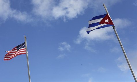 The flags of the United States and Cuba are seen flying in the Little Havana neighborhood of Miami, Florida January 26, 2012. REUTERS/Shanno The flags of the United States and Cuba are seen flying in the Little Havana neighborhood of Miami, Florida January 26, 2012. REUTERS/Shanno