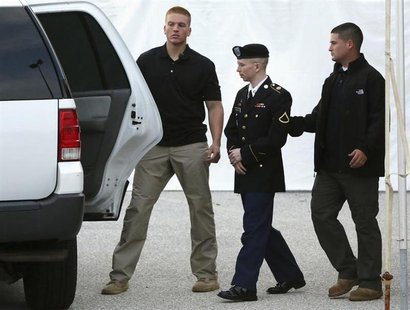 U.S. Army Private First Class Bradley Manning (C) is escorted out after a day of testimony at his court martial trial at Fort Meade, Marylan U.S. Army Private First Class Bradley Manning (C) is escorted out after a day of testimony at his court martial trial at Fort Meade, Marylan