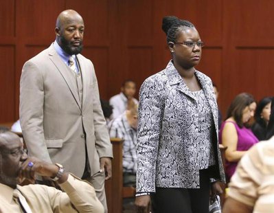 The parents of Trayvon Martin, Tracy Martin and Sybrina Fulton, arrive in the courtroom for the George Zimmerman trial in Seminole circuit c The parents of Trayvon Martin, Tracy Martin and Sybrina Fulton, arrive in the courtroom for the George Zimmerman trial in Seminole circuit c
