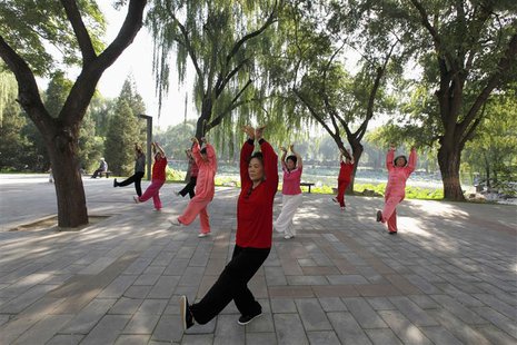 People practise tai chi, a Chinese martial art, during morning exercises at Longtan Park in Beijing September 13, 2010. REUTERS/Grace Liang People practise tai chi, a Chinese martial art, during morning exercises at Longtan Park in Beijing September 13, 2010. REUTERS/Grace Liang