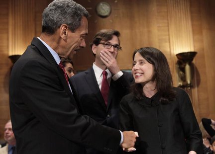 Representative Mel Watt (L), nominee to be the regulator of mortgage finance firms Fannie Mae and Freddie Mac, shakes hands with Kara Stein, Representative Mel Watt (L), nominee to be the regulator of mortgage finance firms Fannie Mae and Freddie Mac, shakes hands with Kara Stein,