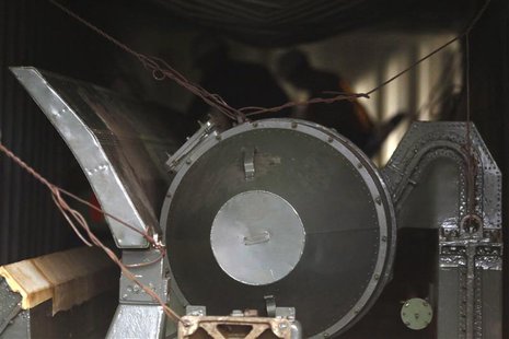 A close up shows a missile-shaped object as forensic workers (background) work inside a container holding arms seized from the North Korean A close up shows a missile-shaped object as forensic workers (background) work inside a container holding arms seized from the North Korean