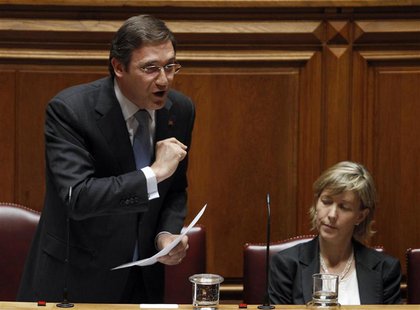 Portugal's Prime Minister Pedro Passos Coelho (L) gestures beside Finance Minister Maria Luis Albuquerque during a no-confidence session at Portugal's Prime Minister Pedro Passos Coelho (L) gestures beside Finance Minister Maria Luis Albuquerque during a no-confidence session at