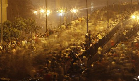 Supporters of deposed Egyptian President Mohamed Mursi run from tear gas fired by riot police during clashes on the Sixth of October Bridge Supporters of deposed Egyptian President Mohamed Mursi run from tear gas fired by riot police during clashes on the Sixth of October Bridge