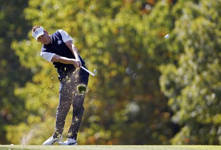 Team Europe golfer Ian Poulter of England hits his approach shot to the seventh green during the 39th Ryder Cup singles golf matches at the Team Europe golfer Ian Poulter of England hits his approach shot to the seventh green during the 39th Ryder Cup singles golf matches at the