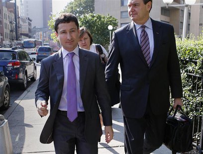 Former Goldman Sachs bond trader Fabrice Tourre (L) arrives with members of his legal team at the Manhattan Federal Court in New York, July Former Goldman Sachs bond trader Fabrice Tourre (L) arrives with members of his legal team at the Manhattan Federal Court in New York, July