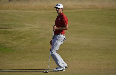 Adam Scott of Australia reacts after making his birdie putt on the 17th green during the first round of the British Open golf Championship a Adam Scott of Australia reacts after making his birdie putt on the 17th green during the first round of the British Open golf Championship a