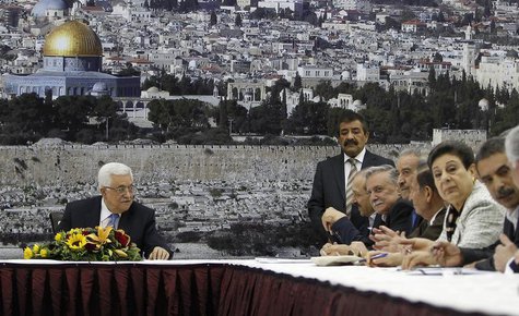 Palestinian President Mahmoud Abbas (L) attends a meeting of the Palestinian leadership in the West Bank city of Ramallah July 18, 2013. REU Palestinian President Mahmoud Abbas (L) attends a meeting of the Palestinian leadership in the West Bank city of Ramallah July 18, 2013. REU