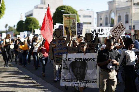 Demonstrators march to protest the acquittal of George Zimmerman in the killing of Florida teen Trayvon Martin in Beverly Hills, California Demonstrators march to protest the acquittal of George Zimmerman in the killing of Florida teen Trayvon Martin in Beverly Hills, California