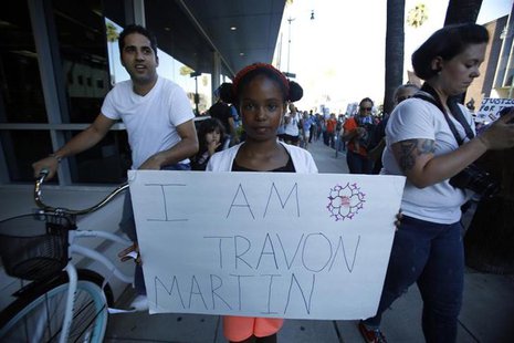 Thandiee Abdullah, 9, holds a placard as she marches to protest the acquittal of George Zimmerman in the killing of Florida teen Trayvon Mar Thandiee Abdullah, 9, holds a placard as she marches to protest the acquittal of George Zimmerman in the killing of Florida teen Trayvon Mar