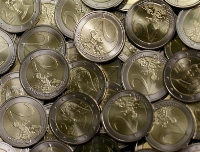 Two Euro coins are seen after beeing minted in the Austrian Mint (Muenze Oesterreich) headquarters in Vienna June 20, 2013.REUTERS/Leonhard Two Euro coins are seen after beeing minted in the Austrian Mint (Muenze Oesterreich) headquarters in Vienna June 20, 2013.REUTERS/Leonhard