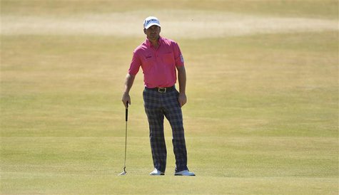 Graeme McDowell of Northern Ireland waits on the tenth green during the second round of the British Open golf Championship at Muirfield in S Graeme McDowell of Northern Ireland waits on the tenth green during the second round of the British Open golf Championship at Muirfield in S