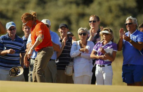 Miguel Angel Jimenez of Spain reacts after missing a birdie putt on the 15th green during second round of the British Open golf championship Miguel Angel Jimenez of Spain reacts after missing a birdie putt on the 15th green during second round of the British Open golf championship