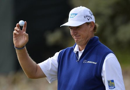 Ernie Els of South Africa acknowledges the crowd after making a parr putt on the second green during the first round of the British Open gol Ernie Els of South Africa acknowledges the crowd after making a parr putt on the second green during the first round of the British Open gol