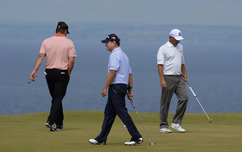 Nick Faldo of England, Tom Watson of the U.S, and Fred Couples of the U.S (L-R) walk across the 11th green during the first round of the Bri Nick Faldo of England, Tom Watson of the U.S, and Fred Couples of the U.S (L-R) walk across the 11th green during the first round of the Bri