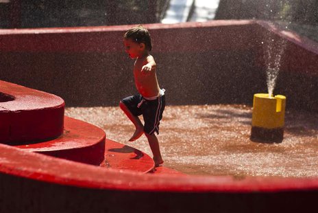 A boy plays with water during a hot day in New York July 19, 2013. REUTERS/Eduardo Munoz A boy plays with water during a hot day in New York July 19, 2013. REUTERS/Eduardo Munoz