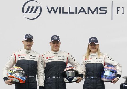 (L-R) Williams Formula One drivers Pastor Maldonado and Valtteri Bottas and test-driver Susie Wolff pose with the new FW35 racing car during (L-R) Williams Formula One drivers Pastor Maldonado and Valtteri Bottas and test-driver Susie Wolff pose with the new FW35 racing car during