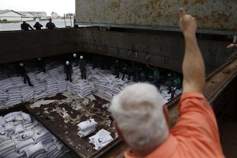 Panama's President Ricardo Martinelli gives a thumbs up to workers inside a North Korean flagged ship, "Chong Chon Gang", docked at the Manz Panama's President Ricardo Martinelli gives a thumbs up to workers inside a North Korean flagged ship, "Chong Chon Gang", docked at the Manz
