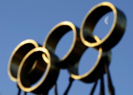 The moon is pictured through a sculpture in front of the International Olympic Committee (IOC) headquarters in Lausanne December 9, 2009. RE The moon is pictured through a sculpture in front of the International Olympic Committee (IOC) headquarters in Lausanne December 9, 2009. RE