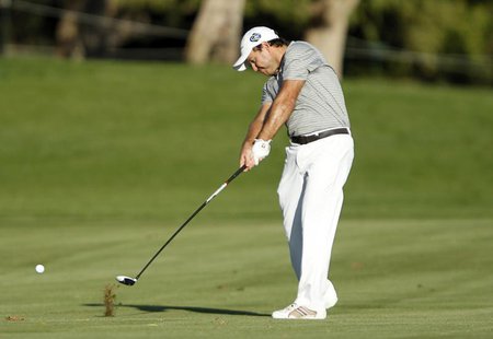 Richard Sterne of South Africa plays a shot at the 18th hole during the fourth and final round of the Dubai Desert Classic at the Emirates G Richard Sterne of South Africa plays a shot at the 18th hole during the fourth and final round of the Dubai Desert Classic at the Emirates G