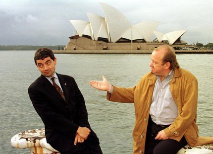 English comedian and actor Rowan Atkinson (L) and compatriot Mel Smith (R) pose for photographers with Sydney's famous landmark the Opera Ho English comedian and actor Rowan Atkinson (L) and compatriot Mel Smith (R) pose for photographers with Sydney's famous landmark the Opera Ho