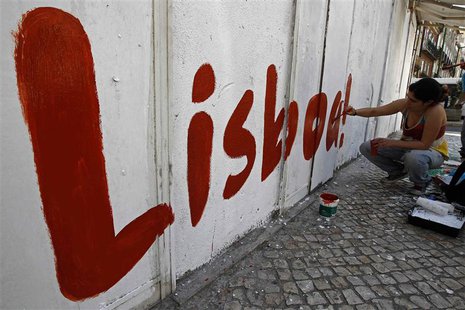 A political activist paints the word "Lisbon" on a wall at a street in Lisbon July 20, 2013. REUTERS/Jose Manuel Ribeiro A political activist paints the word "Lisbon" on a wall at a street in Lisbon July 20, 2013. REUTERS/Jose Manuel Ribeiro