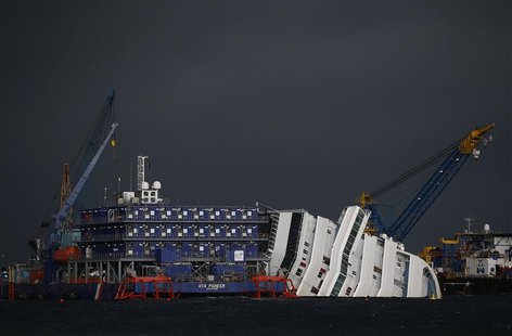 The capsized cruise liner Costa Concordia is surrounded by cranes during a salvage operation in front of Giglio harbour in this January 11, The capsized cruise liner Costa Concordia is surrounded by cranes during a salvage operation in front of Giglio harbour in this January 11,