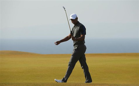 Tiger Woods of the U.S. walks across the 11th green during the third round of the British Open golf championship at Muirfield in Scotland Ju Tiger Woods of the U.S. walks across the 11th green during the third round of the British Open golf championship at Muirfield in Scotland Ju