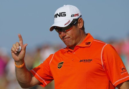 Lee Westwood of England acknowledges the crowd after making his birdie putt on the 14th green during the third round of the British Open gol Lee Westwood of England acknowledges the crowd after making his birdie putt on the 14th green during the third round of the British Open gol