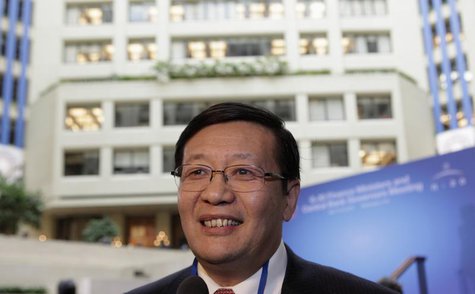 Chinese Minister of Finance Lou Jiwei smiles before the G20 finance ministers and central bank governors family photo during 2013 Spring Mee Chinese Minister of Finance Lou Jiwei smiles before the G20 finance ministers and central bank governors family photo during 2013 Spring Mee