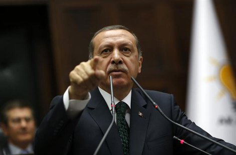 Turkey's Prime Minister Tayyip Erdogan addresses members of parliament from his ruling AK Party (AKP) during a meeting at the Turkish parlia Turkey's Prime Minister Tayyip Erdogan addresses members of parliament from his ruling AK Party (AKP) during a meeting at the Turkish parlia