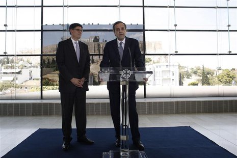 Greece's Prime Minister Antonis Samaras (R) addresses reporters next to U.S. Treasury Secretary Jack Lew at the Athens Acropolis Museum in A Greece's Prime Minister Antonis Samaras (R) addresses reporters next to U.S. Treasury Secretary Jack Lew at the Athens Acropolis Museum in A