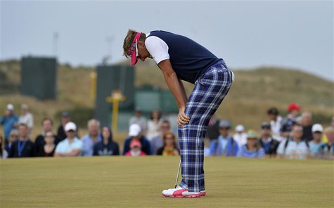 Ian Poulter of England reacts after missing his par putt on the 16th green during the final round of the British Open golf Championship at M Ian Poulter of England reacts after missing his par putt on the 16th green during the final round of the British Open golf Championship at M
