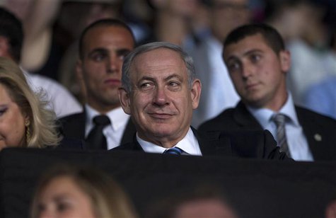 Israel's Prime Minister Benjamin Netanyahu smiles during the opening ceremony of the 19th Maccabiah Games at Teddy Stadium in Jerusalem July Israel's Prime Minister Benjamin Netanyahu smiles during the opening ceremony of the 19th Maccabiah Games at Teddy Stadium in Jerusalem July