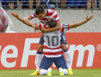 Landon Donovan of the U.S. is embraced by teammate Joe Corona after scoring a goal during the second half of their CONCACAF Gold Cup quarter Landon Donovan of the U.S. is embraced by teammate Joe Corona after scoring a goal during the second half of their CONCACAF Gold Cup quarter