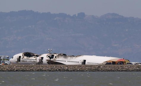 The charred remains of the Asiana Airlines flight 214 sits on the runway at San Francisco International Airport in San Francisco, California The charred remains of the Asiana Airlines flight 214 sits on the runway at San Francisco International Airport in San Francisco, California