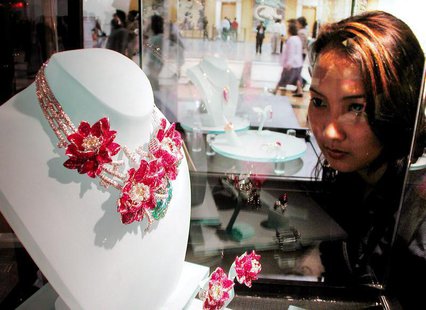 A Thai woman looks at jewelry in a gems and jewelry trade fair in Bangkok September 13, 2000. VP/HL A Thai woman looks at jewelry in a gems and jewelry trade fair in Bangkok September 13, 2000. VP/HL