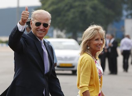 U.S. Vice President Joe Biden gestures as he and his wife Jill (R) arrive at the airport in New Delhi July 22, 2013. Biden is on a four-day U.S. Vice President Joe Biden gestures as he and his wife Jill (R) arrive at the airport in New Delhi July 22, 2013. Biden is on a four-day