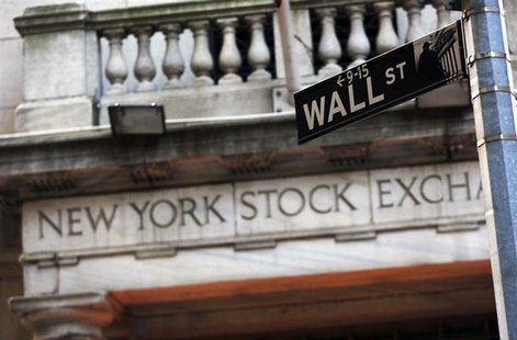 A Wall Street sign is seen in front of the New York Stock Exchange in New York's financial district, March 4, 2013. REUTERS/Brendan McDermid A Wall Street sign is seen in front of the New York Stock Exchange in New York's financial district, March 4, 2013. REUTERS/Brendan McDermid