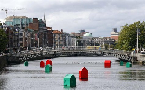 An art installation of Monopoly houses and hotels by Irish contemporary artist Fergal McCarthy floats on the River Liffey in Dublin, in this An art installation of Monopoly houses and hotels by Irish contemporary artist Fergal McCarthy floats on the River Liffey in Dublin, in this