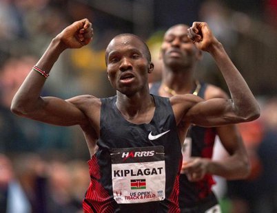 Silas Kiplagat of Kenya reacts at the finish line after beating Bernard Lagat (rear) of the U.S. in the men's 1 mile run at the US Open Trac Silas Kiplagat of Kenya reacts at the finish line after beating Bernard Lagat (rear) of the U.S. in the men's 1 mile run at the US Open Trac