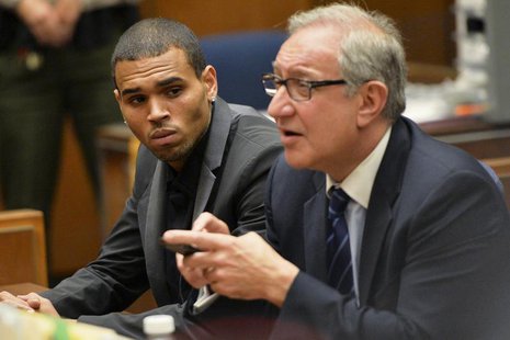 Singer Chris Brown (L) and attorney Mark Geragos attend a probation progress hearing in Los Angeles Superior Court July 15, 2013. REUTERS/Al Singer Chris Brown (L) and attorney Mark Geragos attend a probation progress hearing in Los Angeles Superior Court July 15, 2013. REUTERS/Al