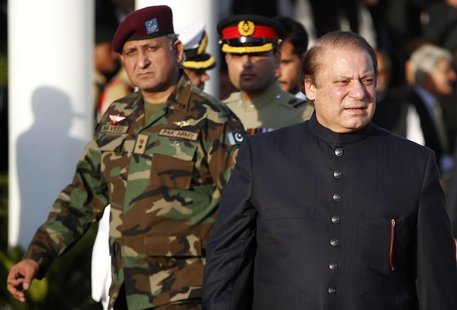 Pakistan's newly elected Prime Minister Nawaz Sharif (R) arrives to inspect the guard of honor during a ceremony at the prime minister's res Pakistan's newly elected Prime Minister Nawaz Sharif (R) arrives to inspect the guard of honor during a ceremony at the prime minister's res