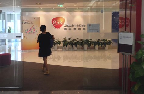 A Chinese employee walks into a GlaxoSmithKline (GSK) office in Beijing, July 19, 2013. REUTERS/Jason Lee A Chinese employee walks into a GlaxoSmithKline (GSK) office in Beijing, July 19, 2013. REUTERS/Jason Lee