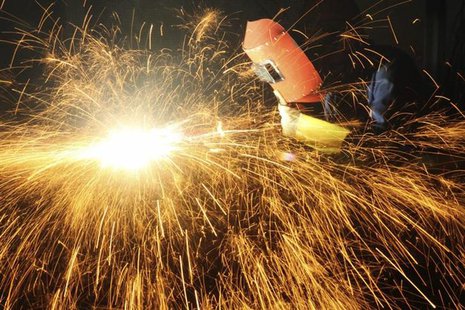 A worker welds inside a factory in Chongqing municipality, June 25, 2013. REUTERS/China Daily A worker welds inside a factory in Chongqing municipality, June 25, 2013. REUTERS/China Daily