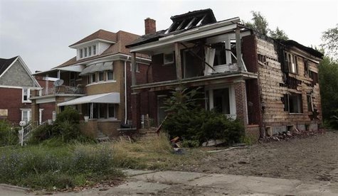 A vacant blighted home is seen next to a well-kept occupied home on West Grand Boulevard in Detroit, Michigan July 23, 2013. REUTERS/ Rebecc A vacant blighted home is seen next to a well-kept occupied home on West Grand Boulevard in Detroit, Michigan July 23, 2013. REUTERS/ Rebecc