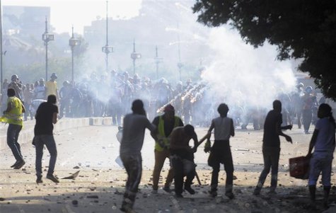 Flares are fired as members of the Muslim Brotherhood and supporters of ousted Egyptian President Mohamed Mursi (back) clash with anti-Mursi Flares are fired as members of the Muslim Brotherhood and supporters of ousted Egyptian President Mohamed Mursi (back) clash with anti-Mursi