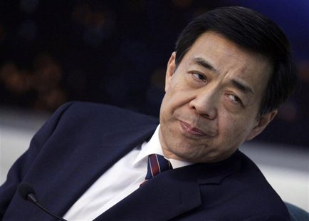 Then Chongqing Municipality Communist Party Secretary Bo Xilai listens to Chongqing's Mayor Huang Qifan (not pictured) during a meeting at t Then Chongqing Municipality Communist Party Secretary Bo Xilai listens to Chongqing's Mayor Huang Qifan (not pictured) during a meeting at t